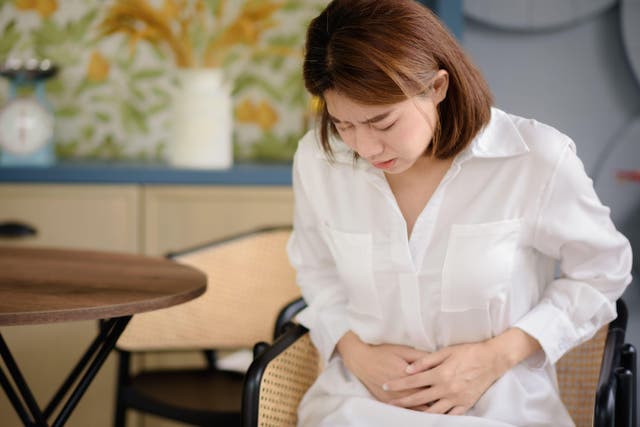 <p>Tummy aches are a symptom of Crohn’s (Alamy/PA)</p>