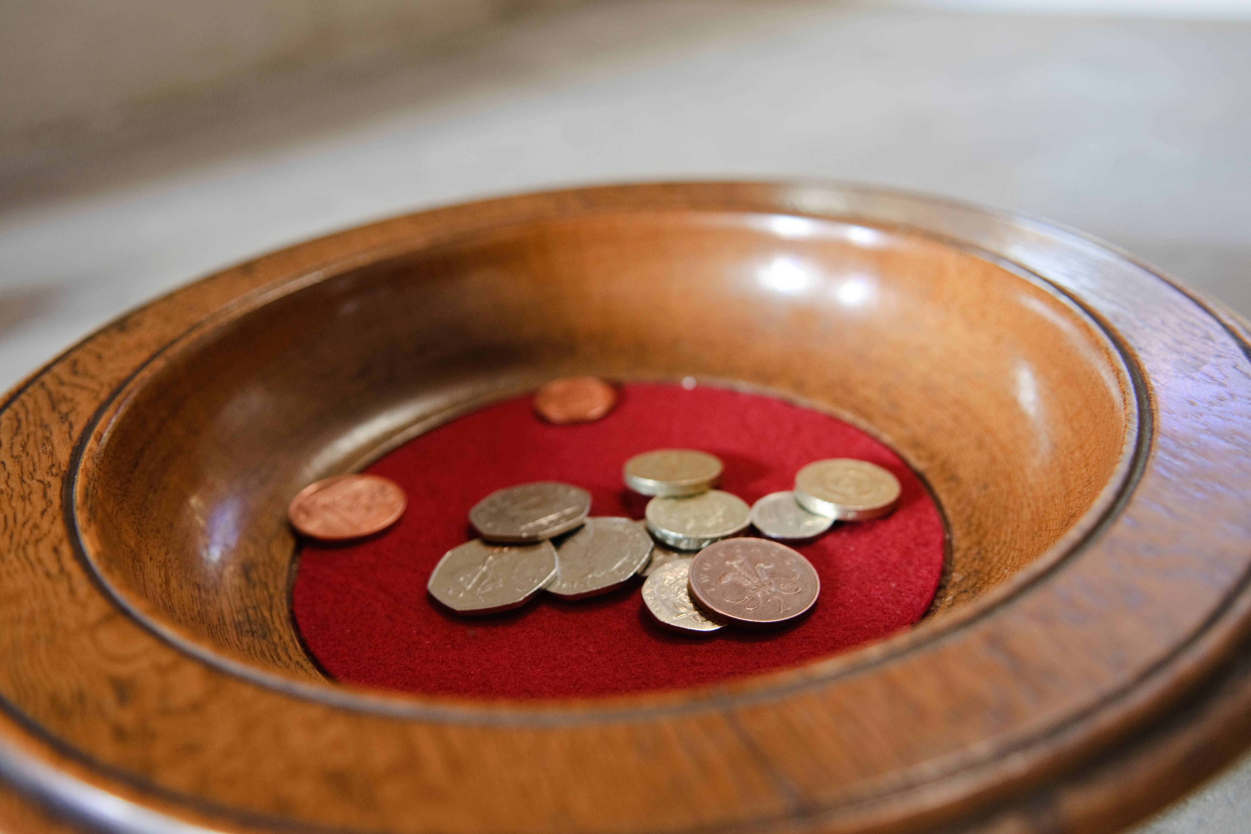 The priest took two plates of money that had been donated, a court heard (Alamy/PA)