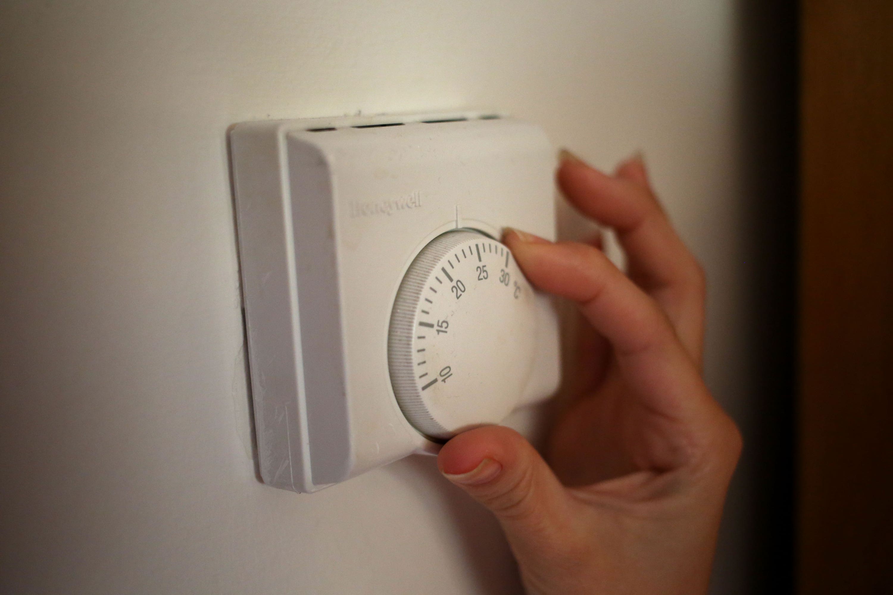 The Energy Saving Trust estimates that people can save 10% on their heating bills for every degree they turn down their thermostats (PA)