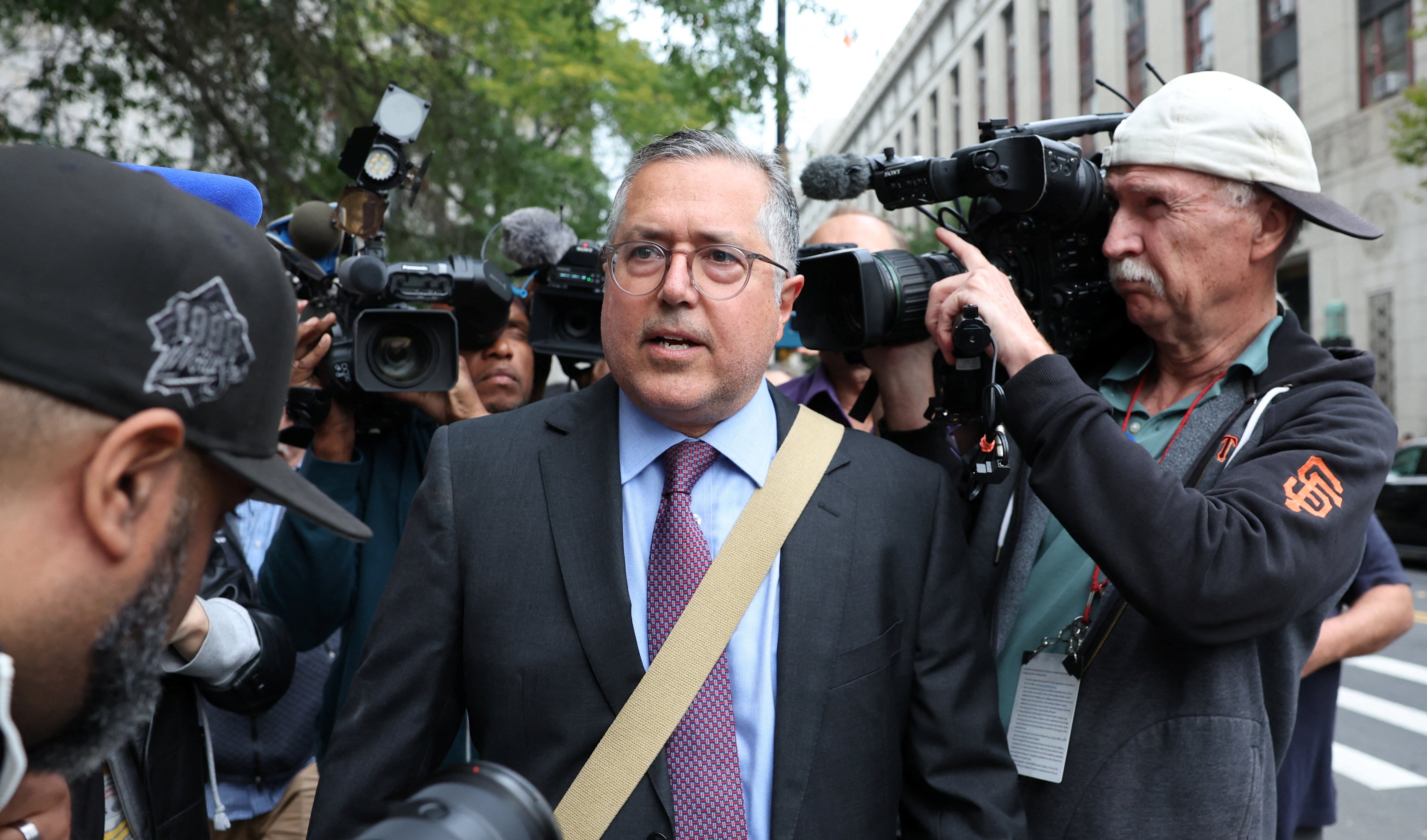 Combs’s lawyer Marc Agnifilo speaks to the press outside of court in New York