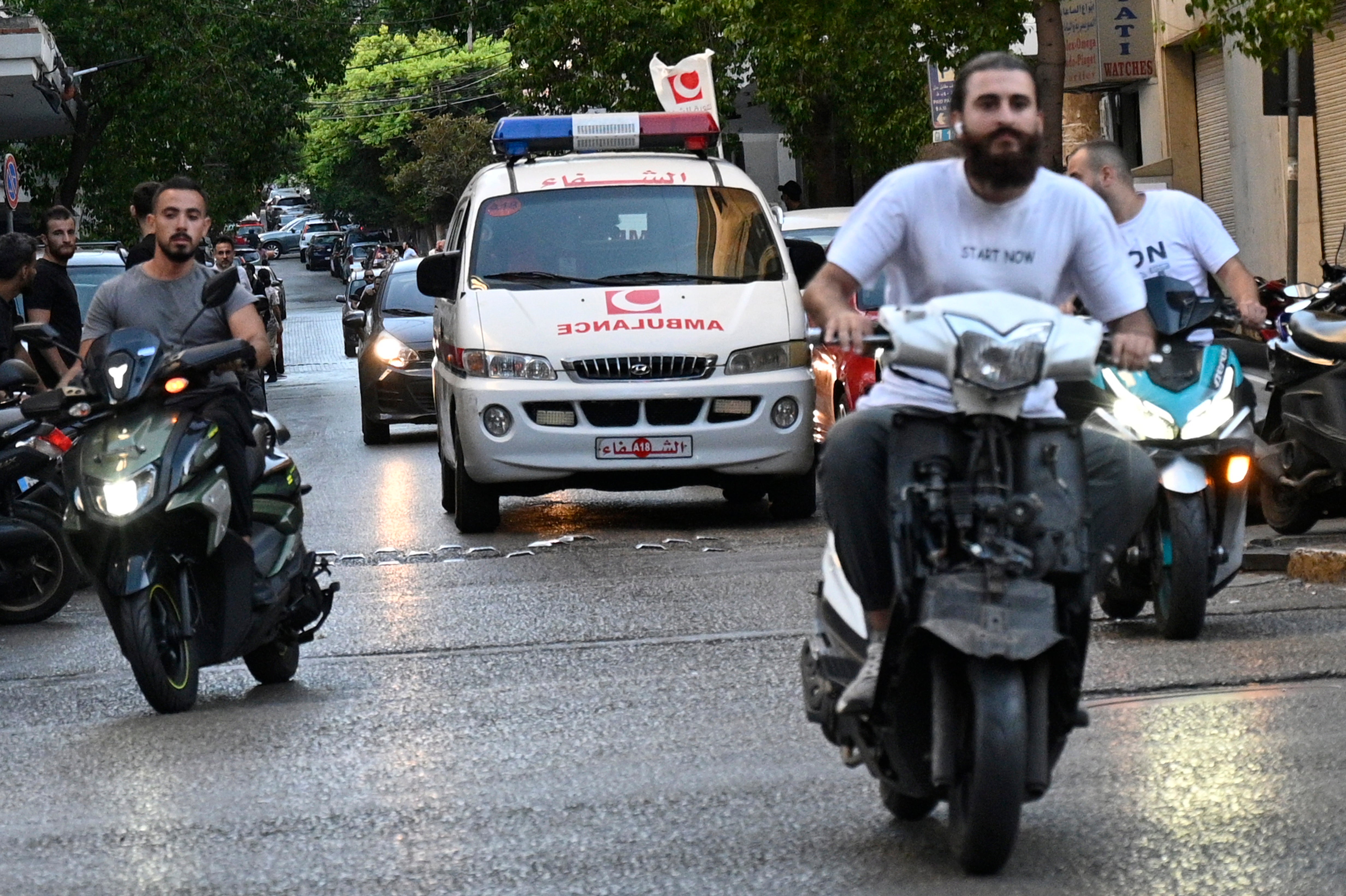 An ambulance can be seen rushing towards a hospital after the pager detonations