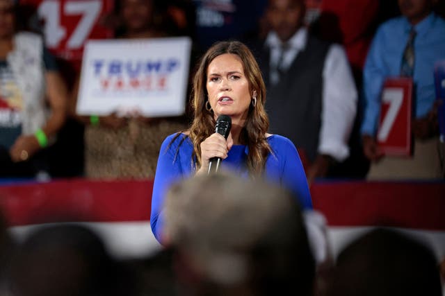 <p>Arkansas Governor Sarah Huckabee Sanders moderates a town hall meeting with former US President and Republican presidential candidate Donald Trump at the Dort Financial Center in Flint, Michigan, on September 17, 2024</p>