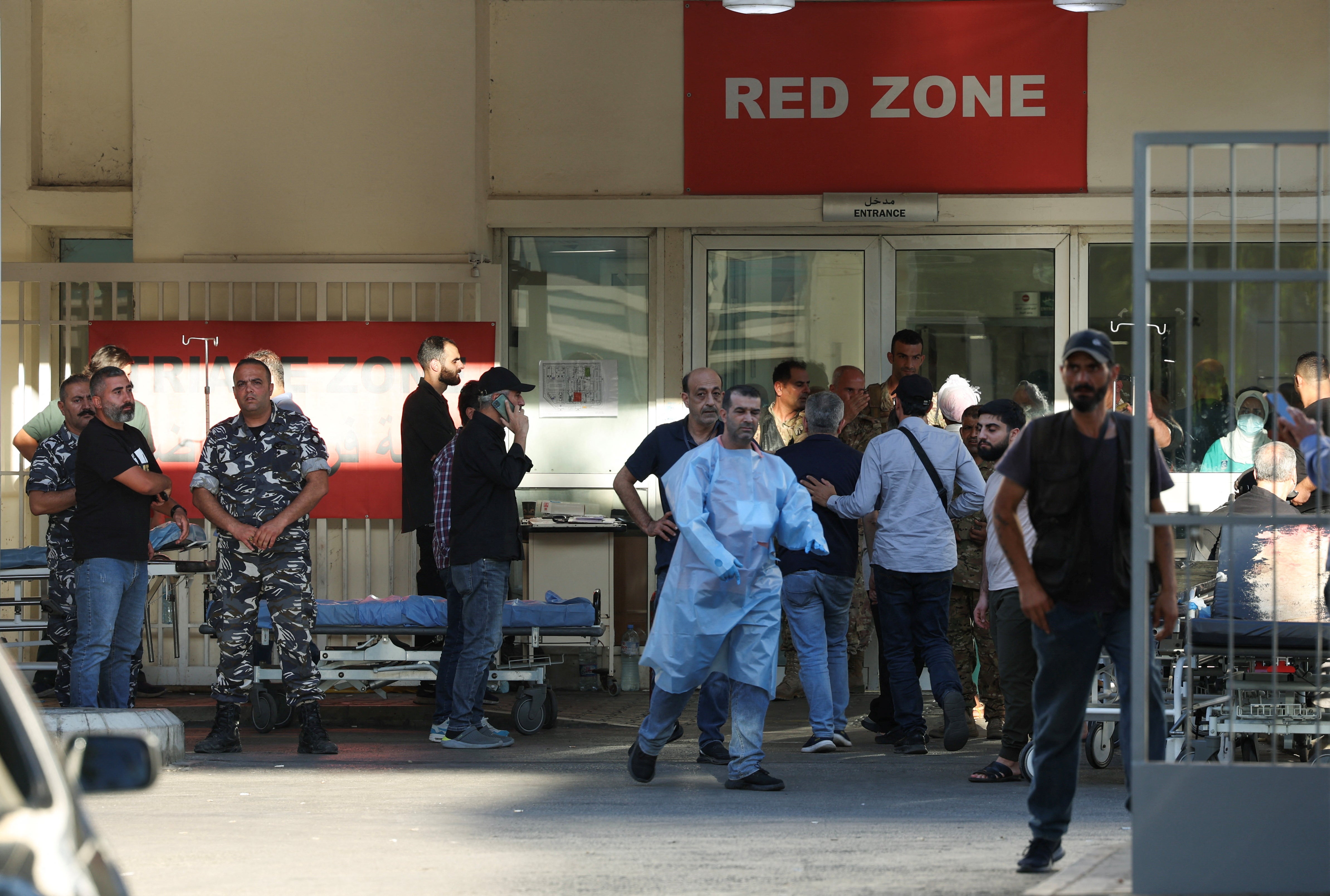 People gather outside a hospital, as several people, including Hezbollah fighters and medics, were wounded on Tuesday, 17 September 2024 in Lebanon