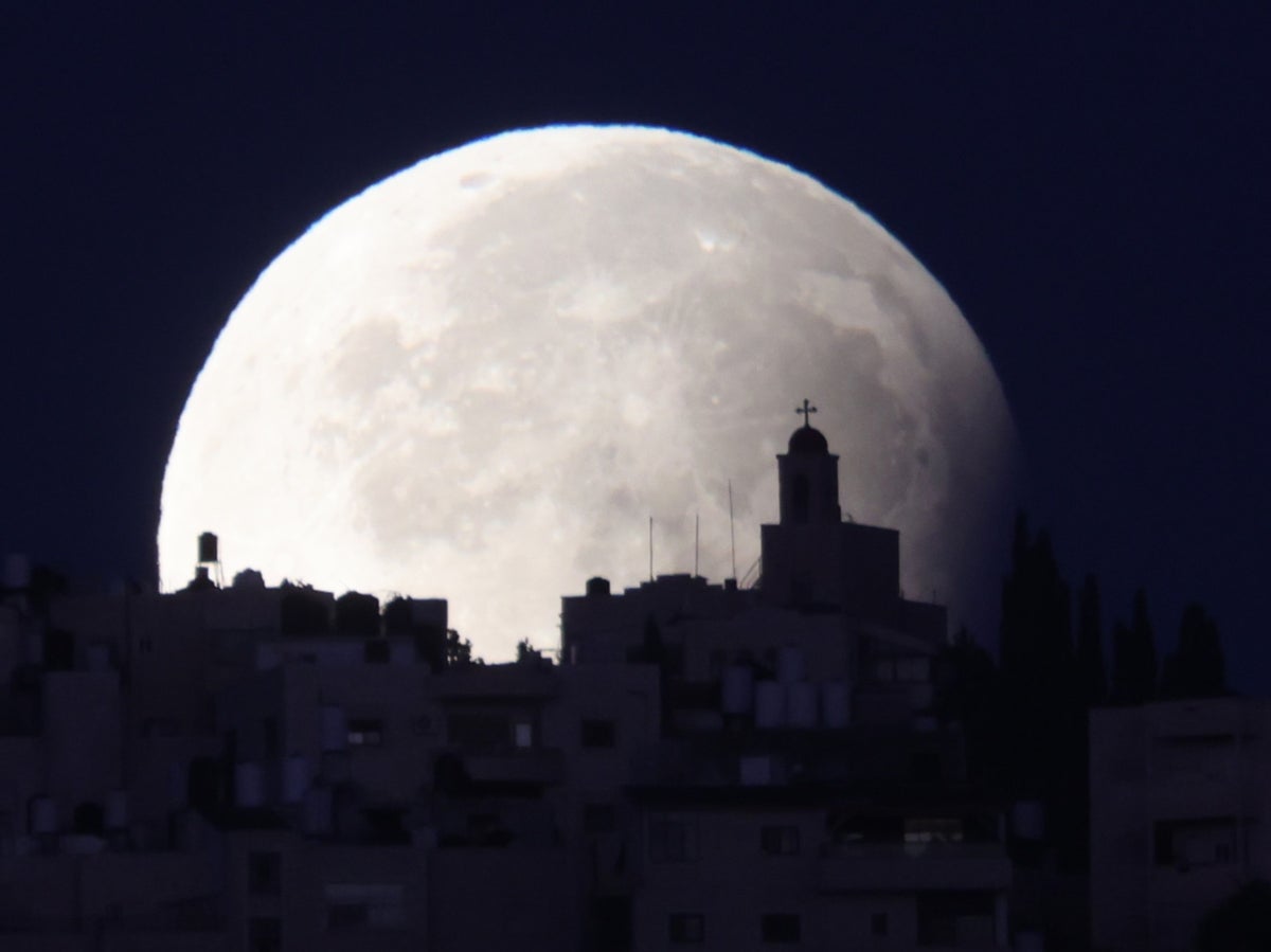 Stunning photos show rare partial lunar eclipse of…