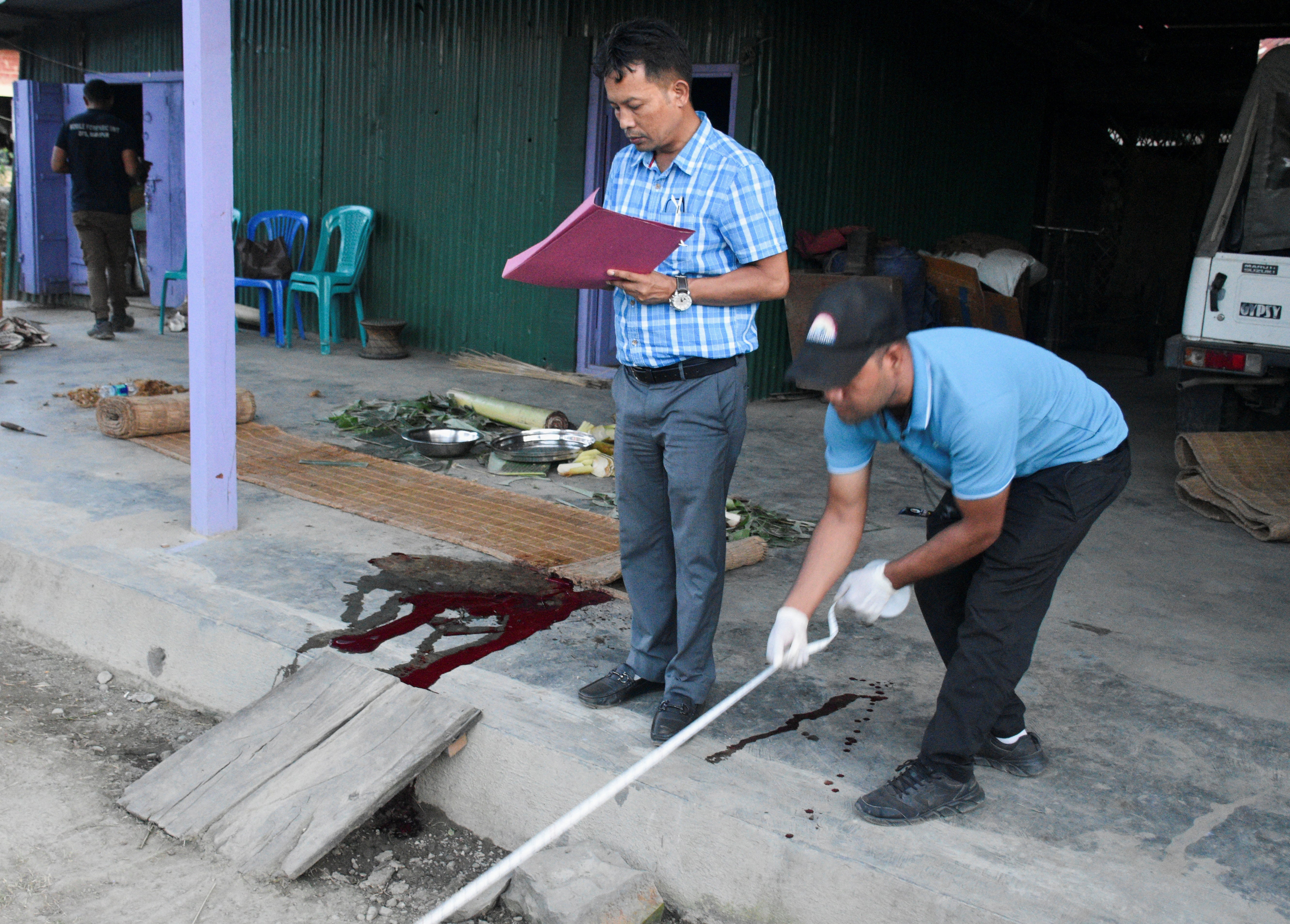 Officials from the state forensic department investigate at the site where a missile struck, at Moirang in Manipur, India, 6 September 2024