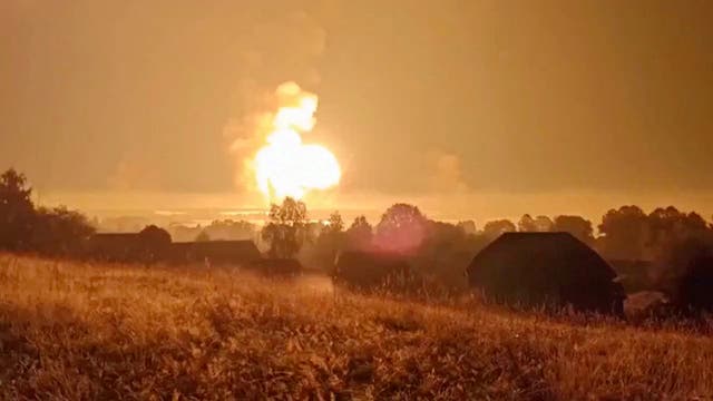 <p>Flames rise from explosions in Toropets in the Tver region of Russia after a Ukrainian drone strike</p>