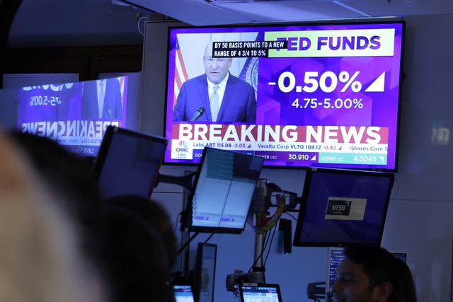 <p>News screens display the Federal Reserve rate announcement on the trading floor at The New York Stock Exchange (NYSE), September 18</p>