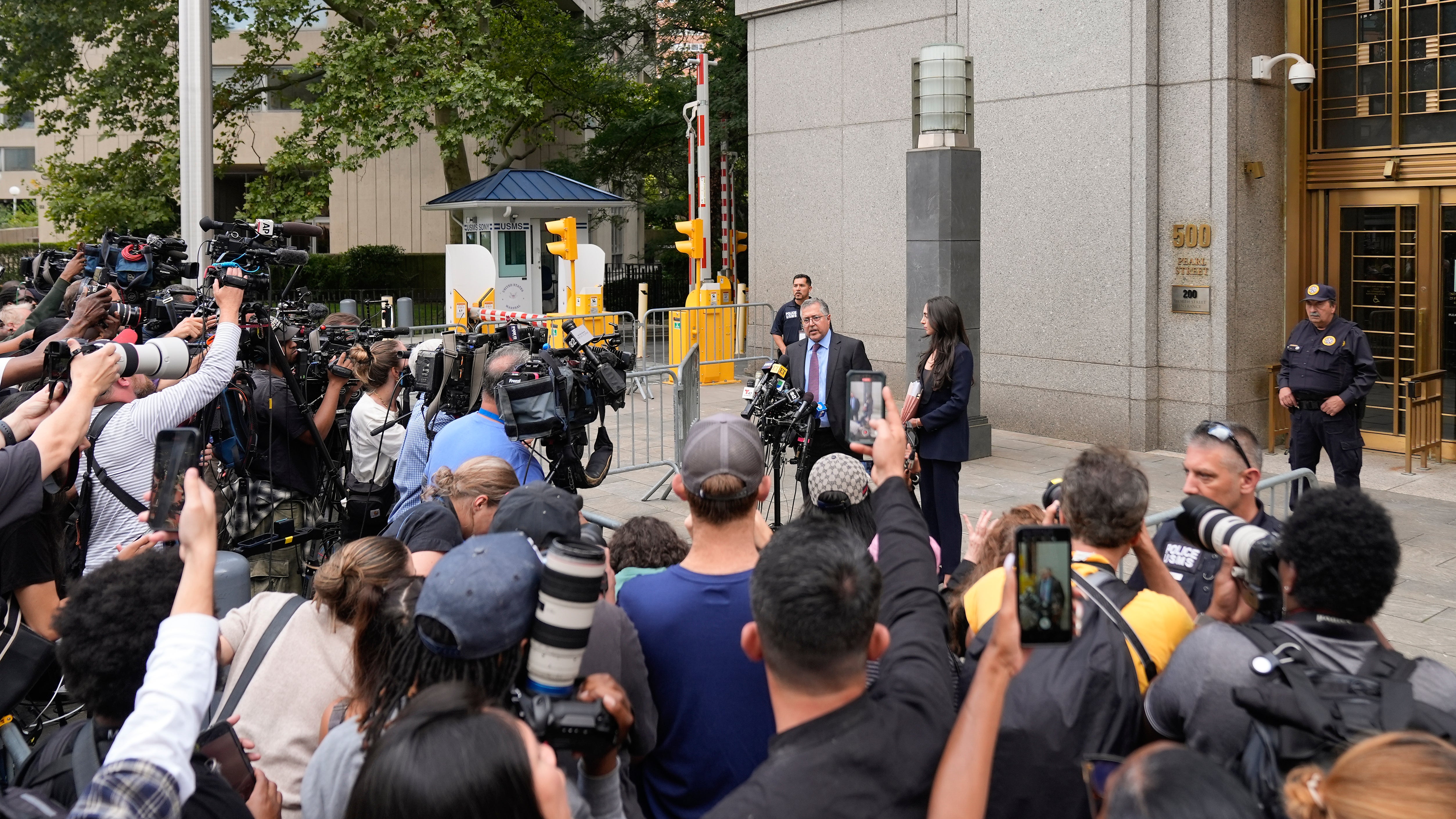 Marc Agnifilo speaks to reporters outside of court on Wednesday