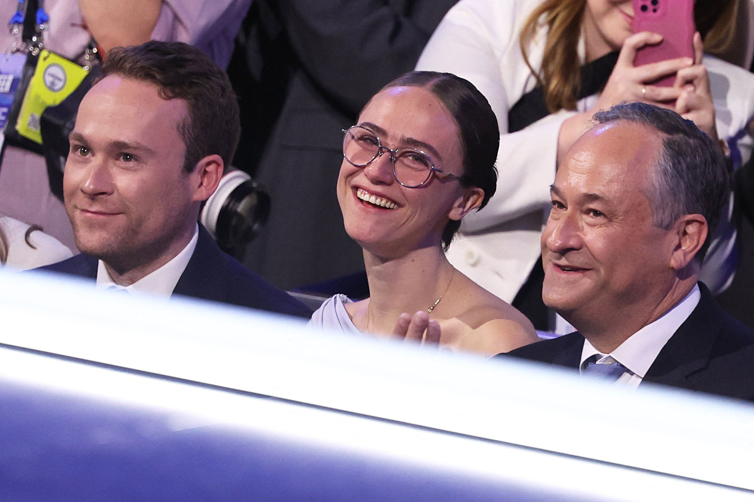 Cole Emhoff (left), Ella Emhoff (center) and Doug Emhoff listen as Kamala Harris speaks at the Democratic National Convention in August. Ella also defended her stepmother against JD Vance’s ‘childless cat lady’ comments earlier this summer