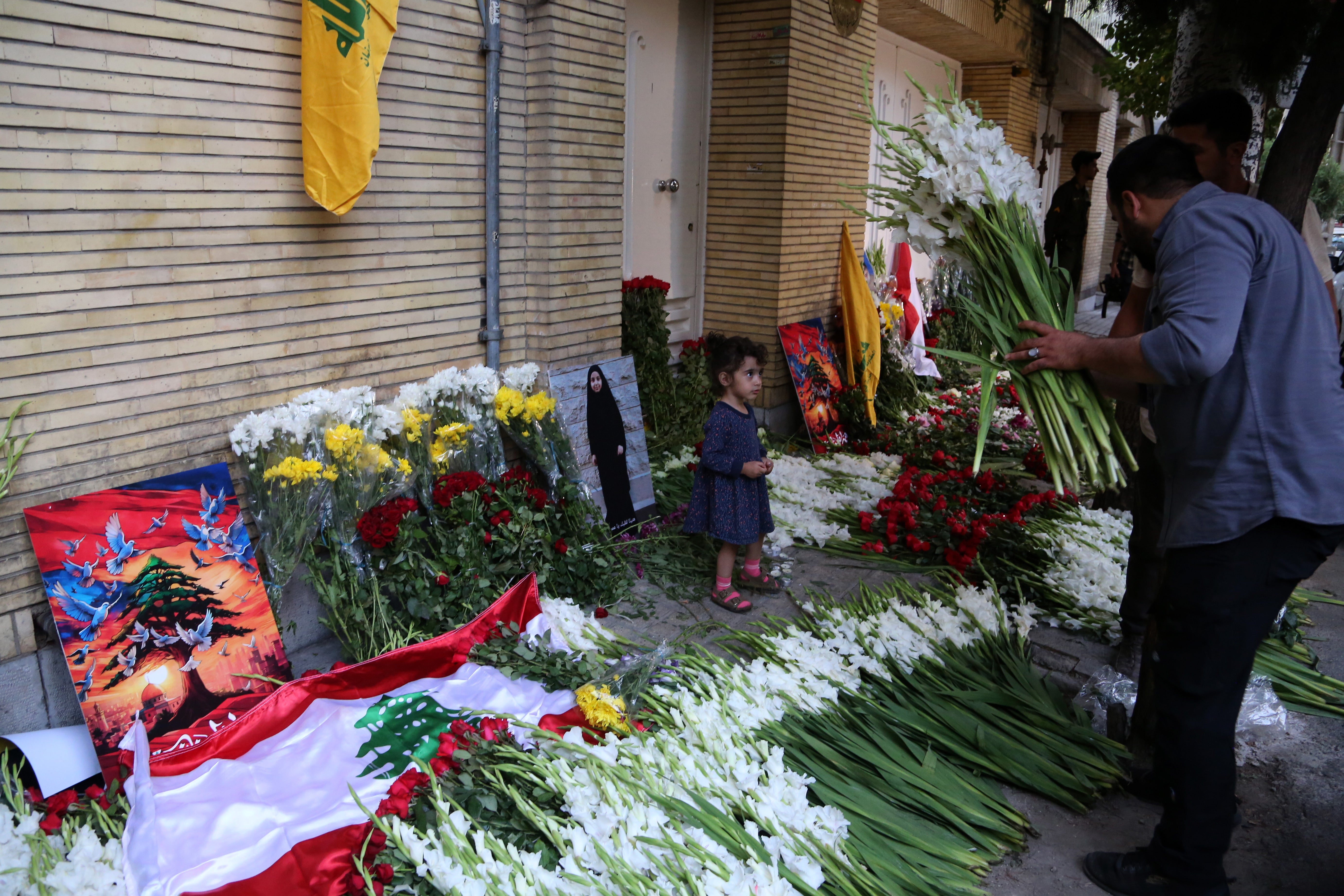 Tributes continue to be laid outside the Lebanese embassy in Tehran