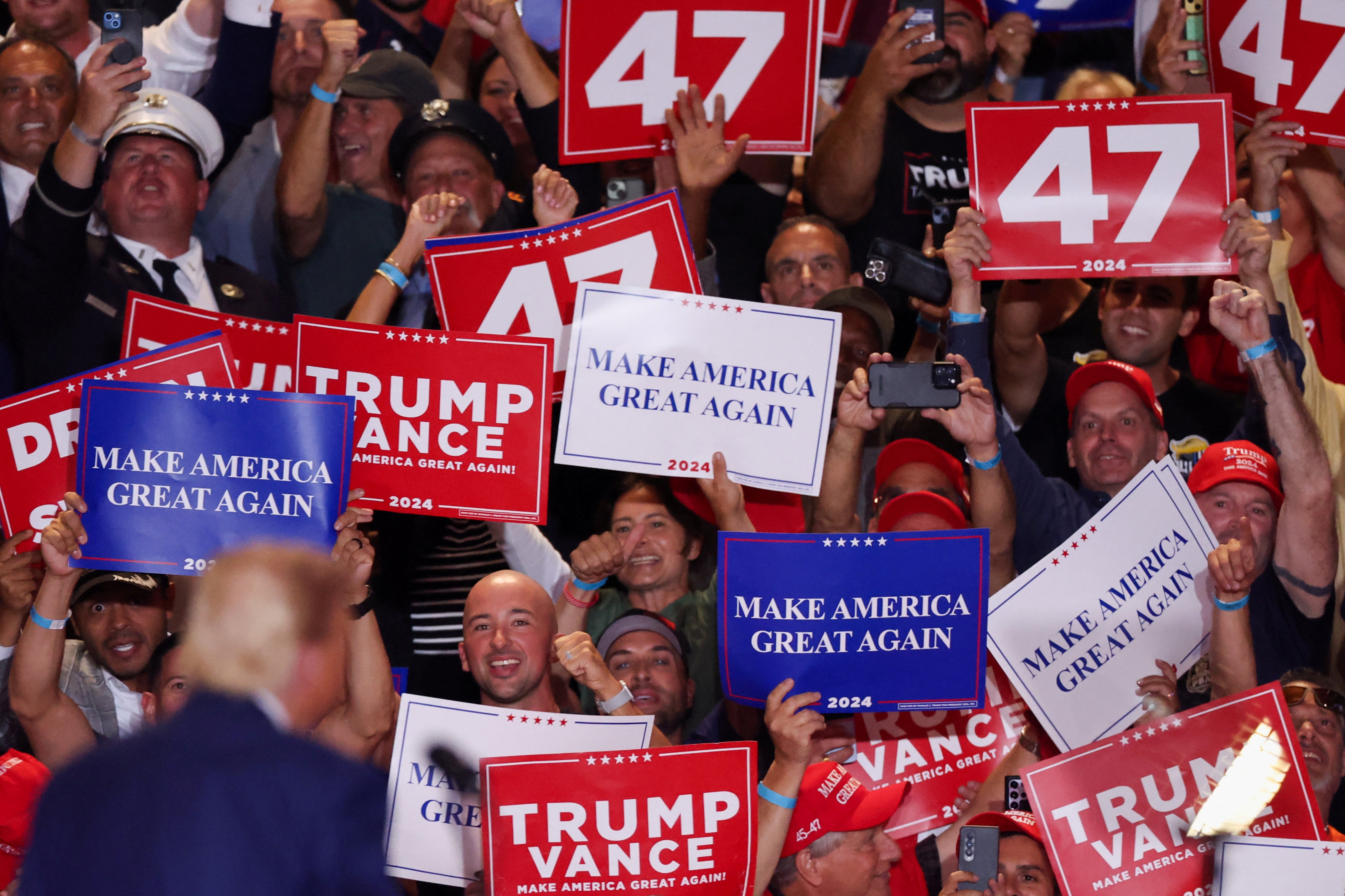 Republican presidential nominee and former U.S. President Donald Trump looks at supporters during a rally at Nassau Veterans Memorial Coliseum, in Uniondale, New York, U.S., September 18, 2024