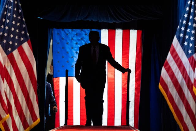 <p>The silhouette of Donald Trump at his rally this week in Long Island, New York. </p>