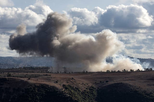 <p>Smoke billows from the site of an Israeli strike on the Lebanon border </p>