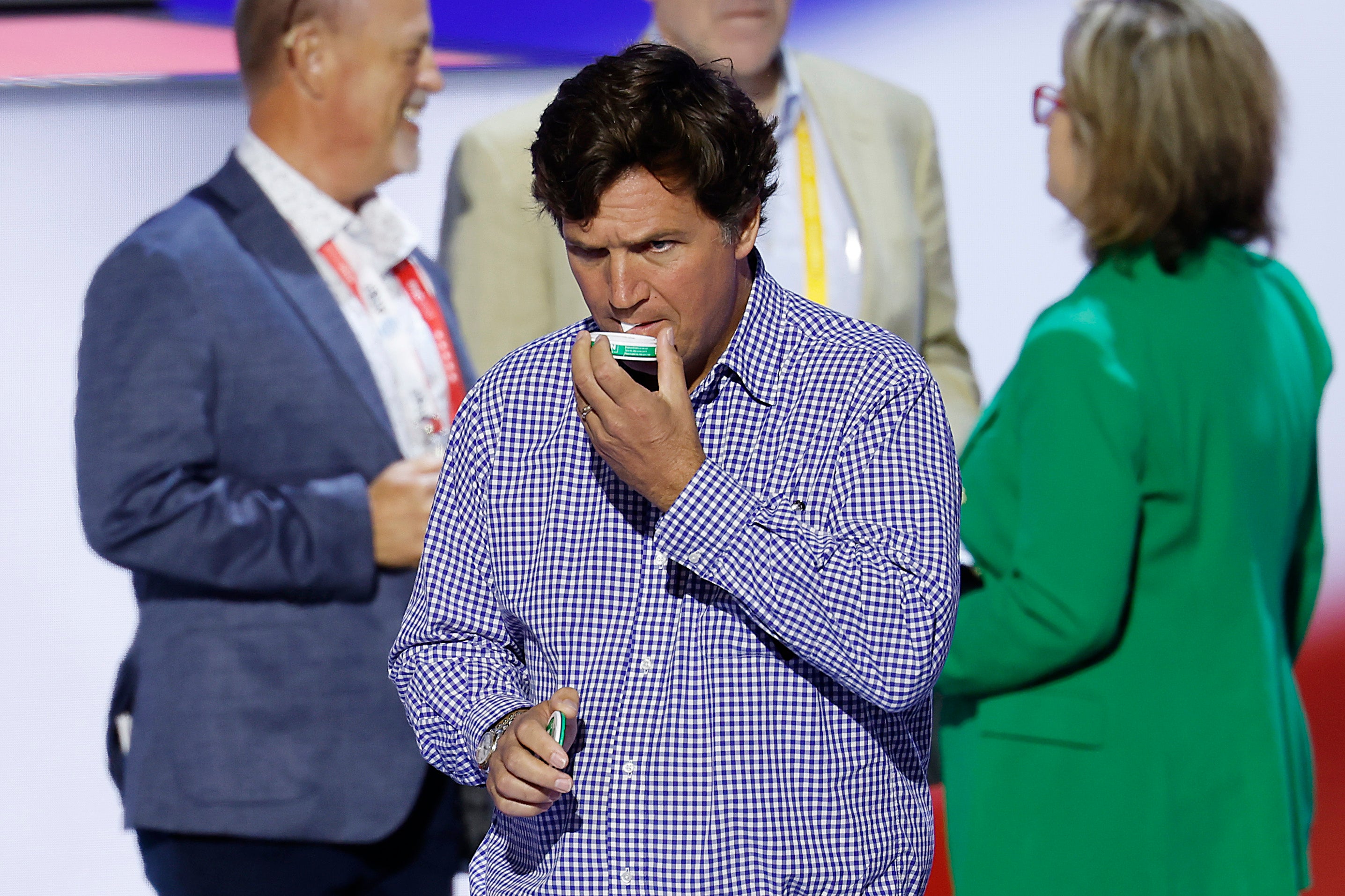 Carlson puts a nicotine pouch in his mouth at the Republican National Convention in July. His fall-out with Zyn started last year, when he claimed the product is a ‘male enhancer'