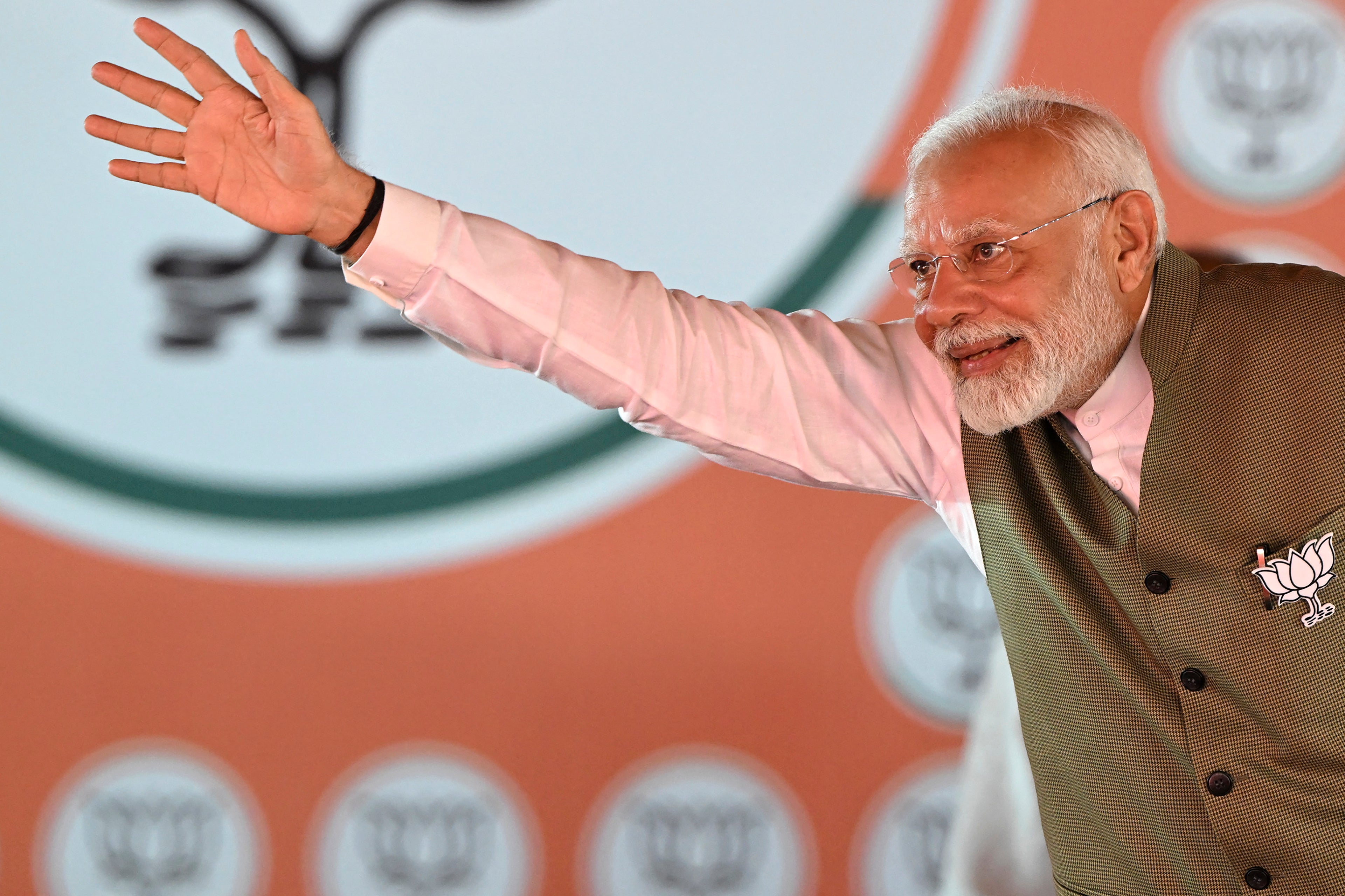 India’s premier  curate  Narendra Modi waves to his supporters during a rally amid the ongoing section  assembly elections, successful  Srinagar connected  19 September 2024