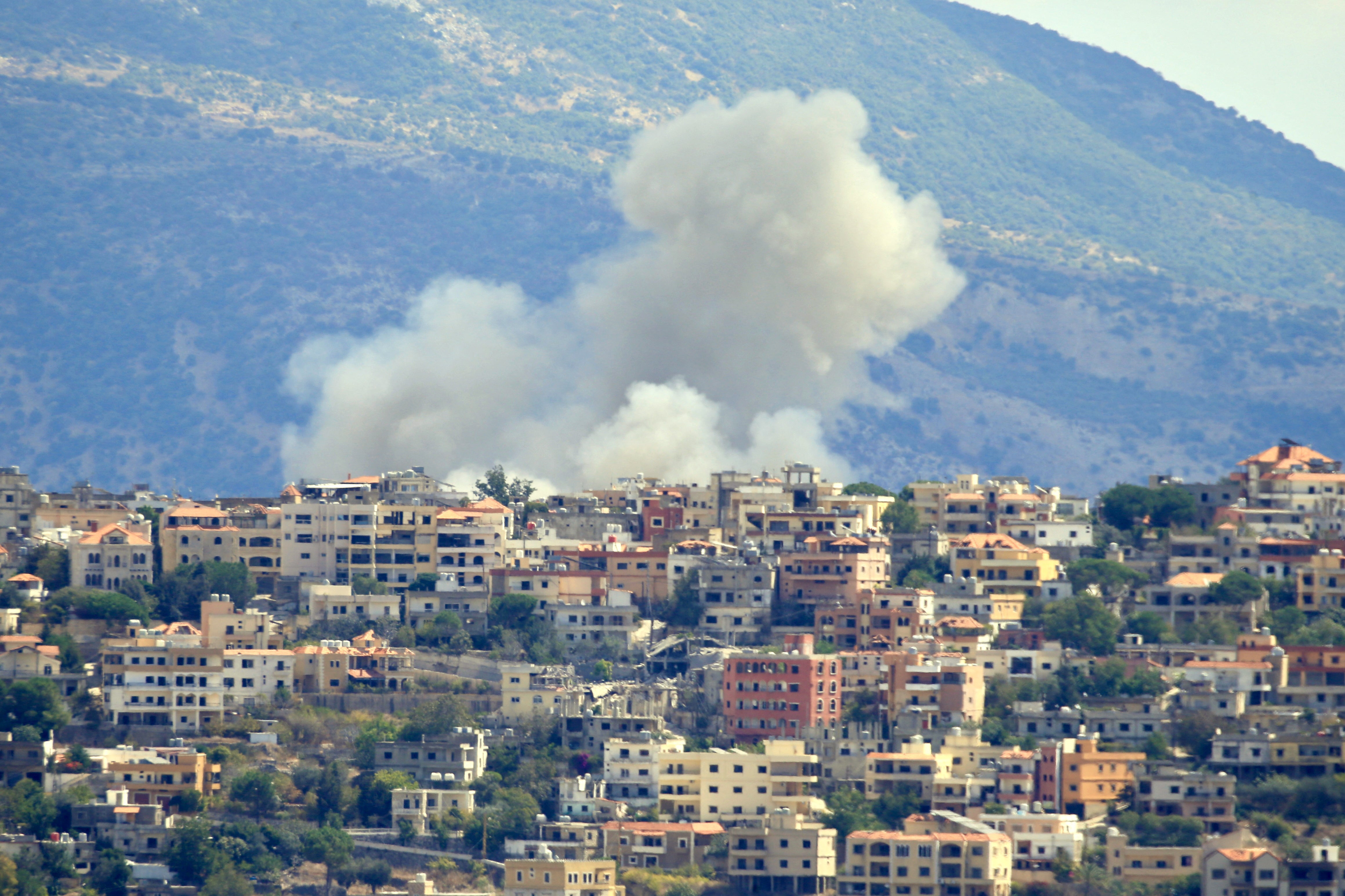 Smoke billows from the site of an Israeli airstrike in the southern Lebanese village of Khiam near the border on 19 September 2024