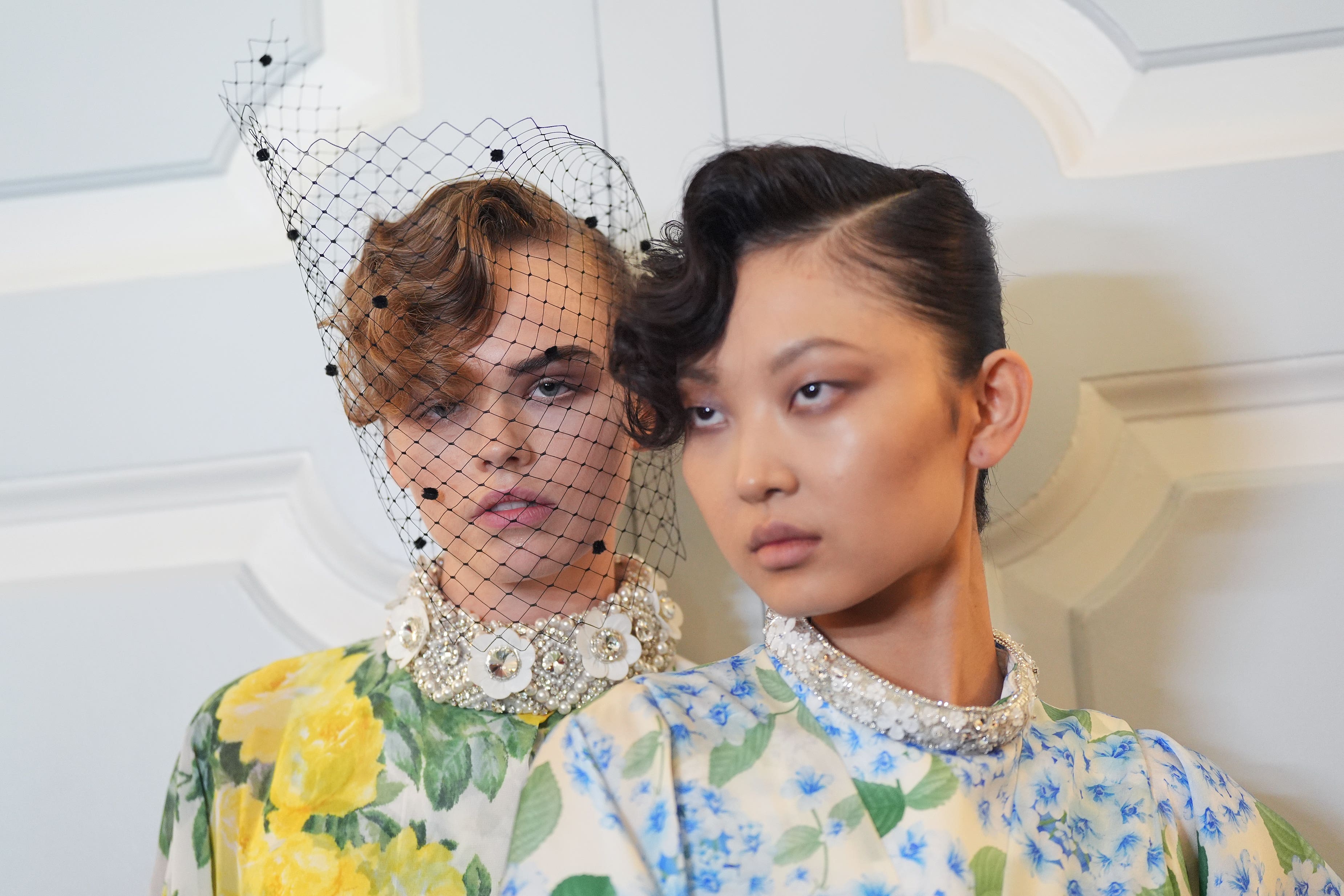 Models walking for Richard Quinn sported slicked back buns with a twist at London Fashion Week (Yui Mok/PA)