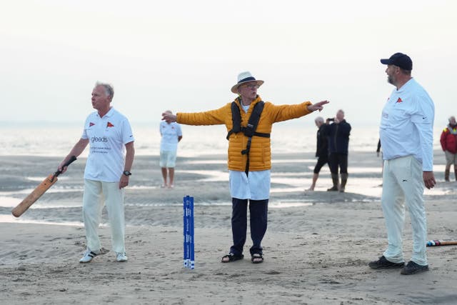 Members of the Royal Southern Yacht Club and the Island Sailing Club take part in the annual Brambles cricket match on the Bramble Bank sandbank in the middle of the Solent at low tide (Andrew Matthews/PA)