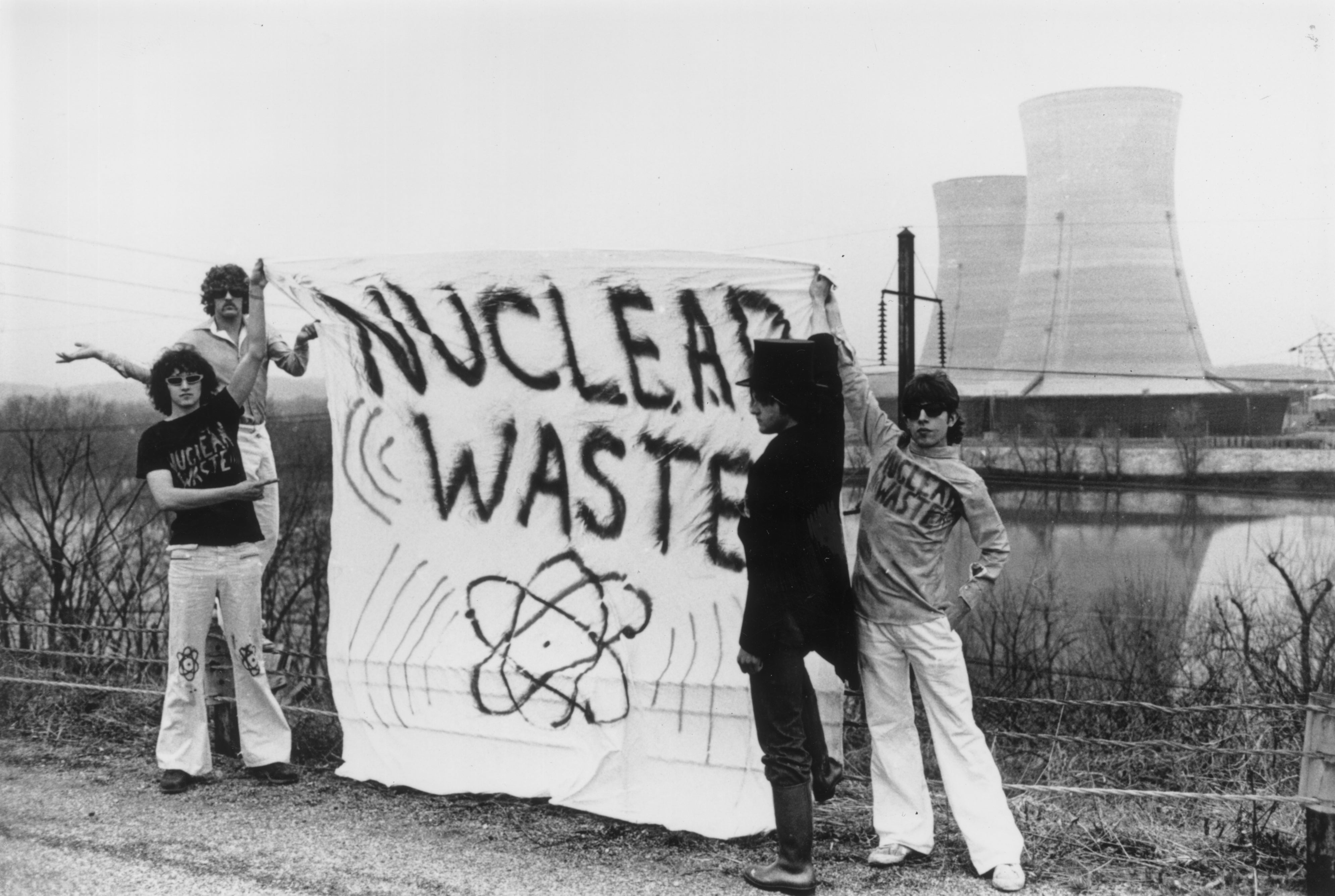 Four anti-nuclear power protestors stand holding a banner reading ‘nuclear waste’ on Three Mile Island near Harrisburg, Pennsylvania, in 1979. The state’s Democratic Gov. Josh Shapiro has assured the new Constellation Energy center will be safe, following the plant’s 1979 reactor accident: the worst in US history.