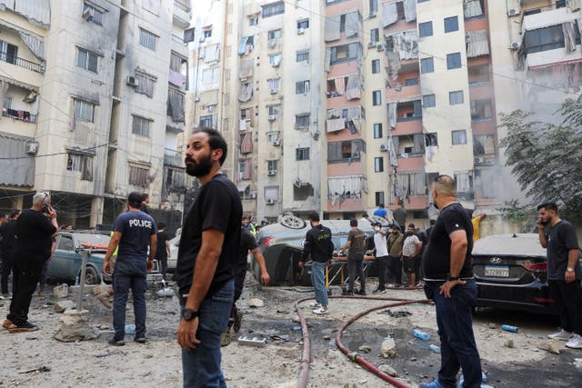 <p>Emergency services attempt to help victims caught in the blast in Beirut  </p>