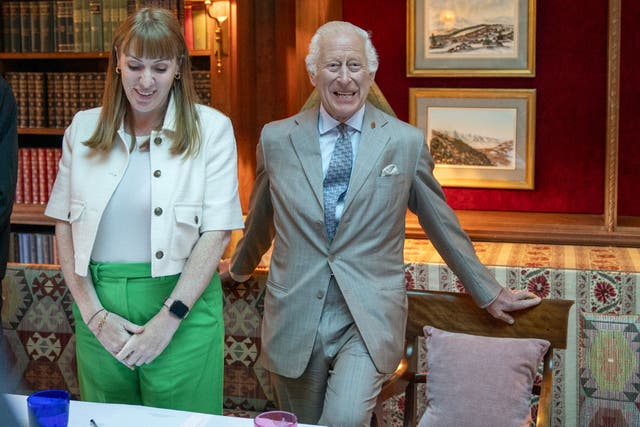 The King, alongside Deputy Prime Minister Angela Rayner, hears about the Violence Reduction Unit in Scotland (Jane Barlow/PA)