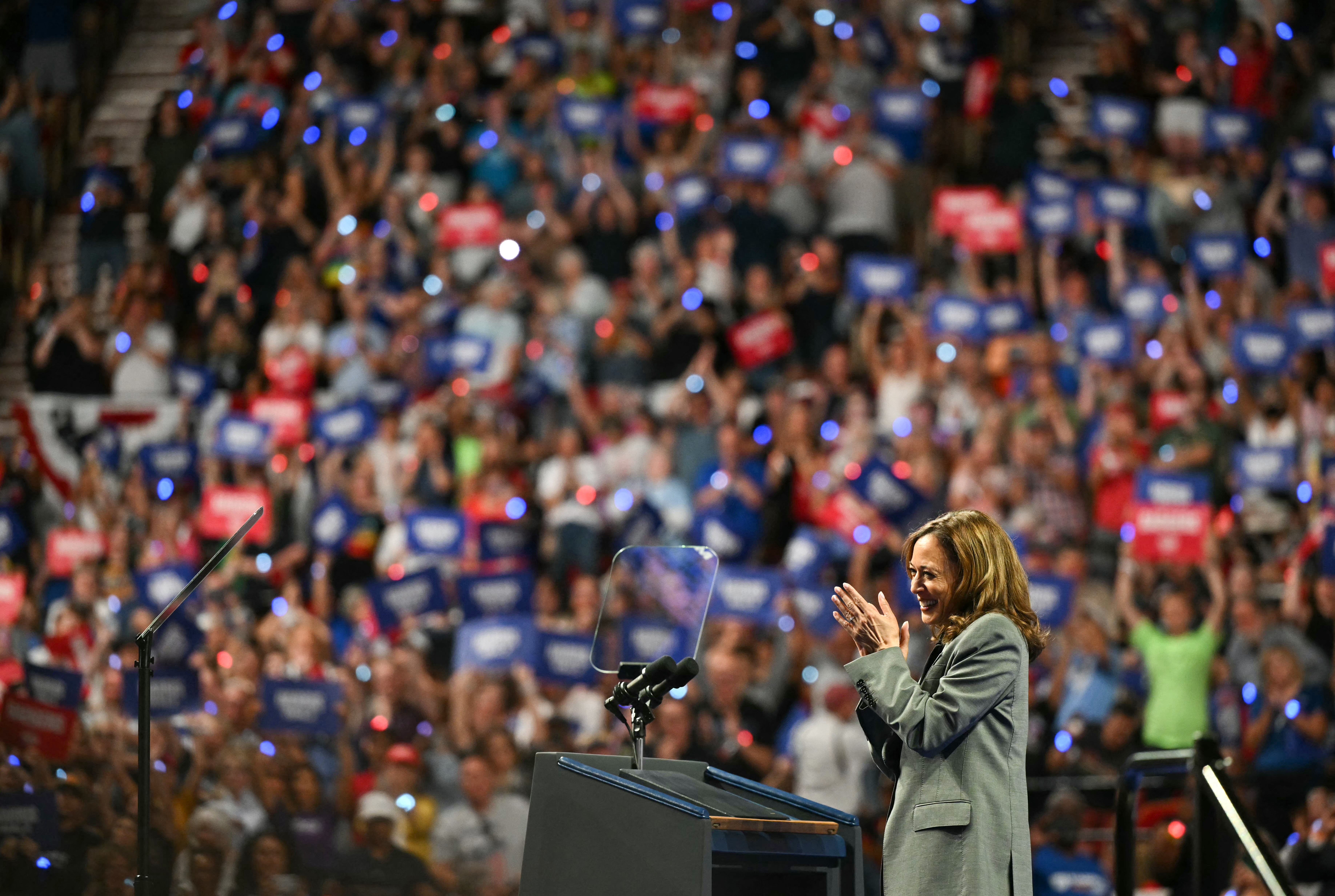 US Vice President and Democratic presidential candidate Kamala Harris applauds the crowd after speaking at a campaign event at Alliant Energy Center in Madison, Wisconsin, on September 20, 2024