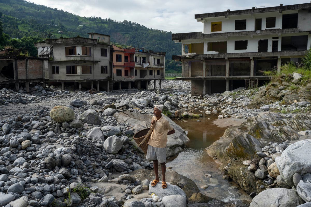 AP PHOTOS: Cascading disasters push residents of a Nepalese valley to the brink