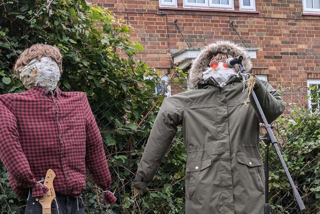 Straw versions of Noel and Liam Gallagher are on display at a Cambridgeshire scarecrow festival (Great Paxton Scarecrow Festival/PA)