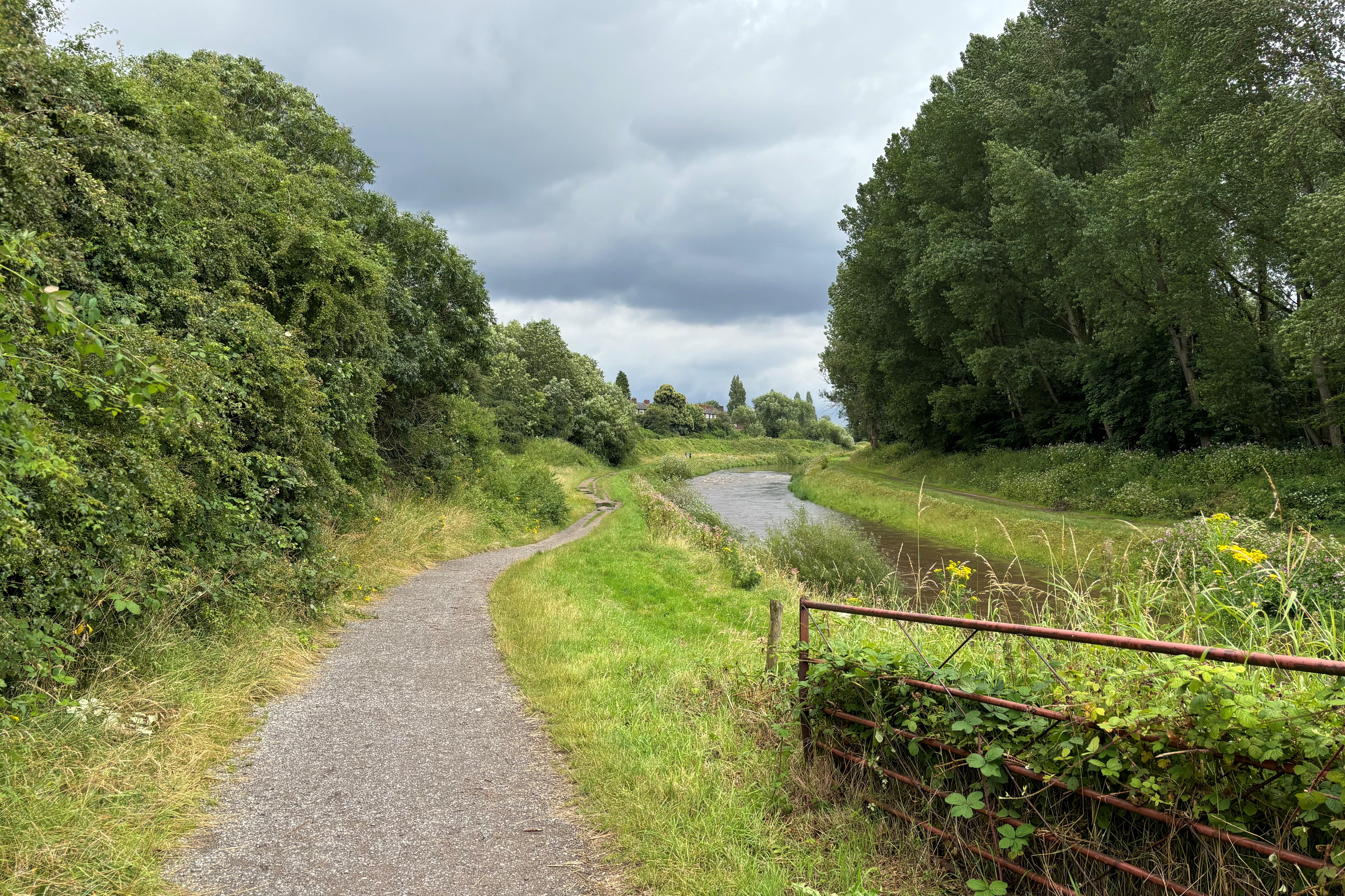 Stretch of the River Mersey near Chorlton Water Park where the still unidentified woman’s body was recovered from the water (Pat Hurst PA)