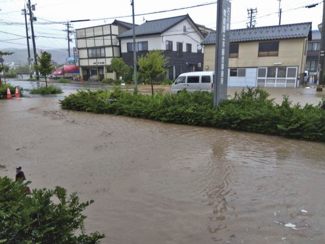 <p>A street is flooded after heavy rain in Wajima, Ishikawa prefecture, on Saturday</p>