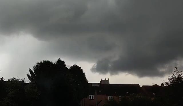 <p>A ‘tornado' developed over Tewkesbury, Gloucestershire, on Friday, as thunderstorms and heavy rain caused widespread disruption to flights and rail services in England.</p>