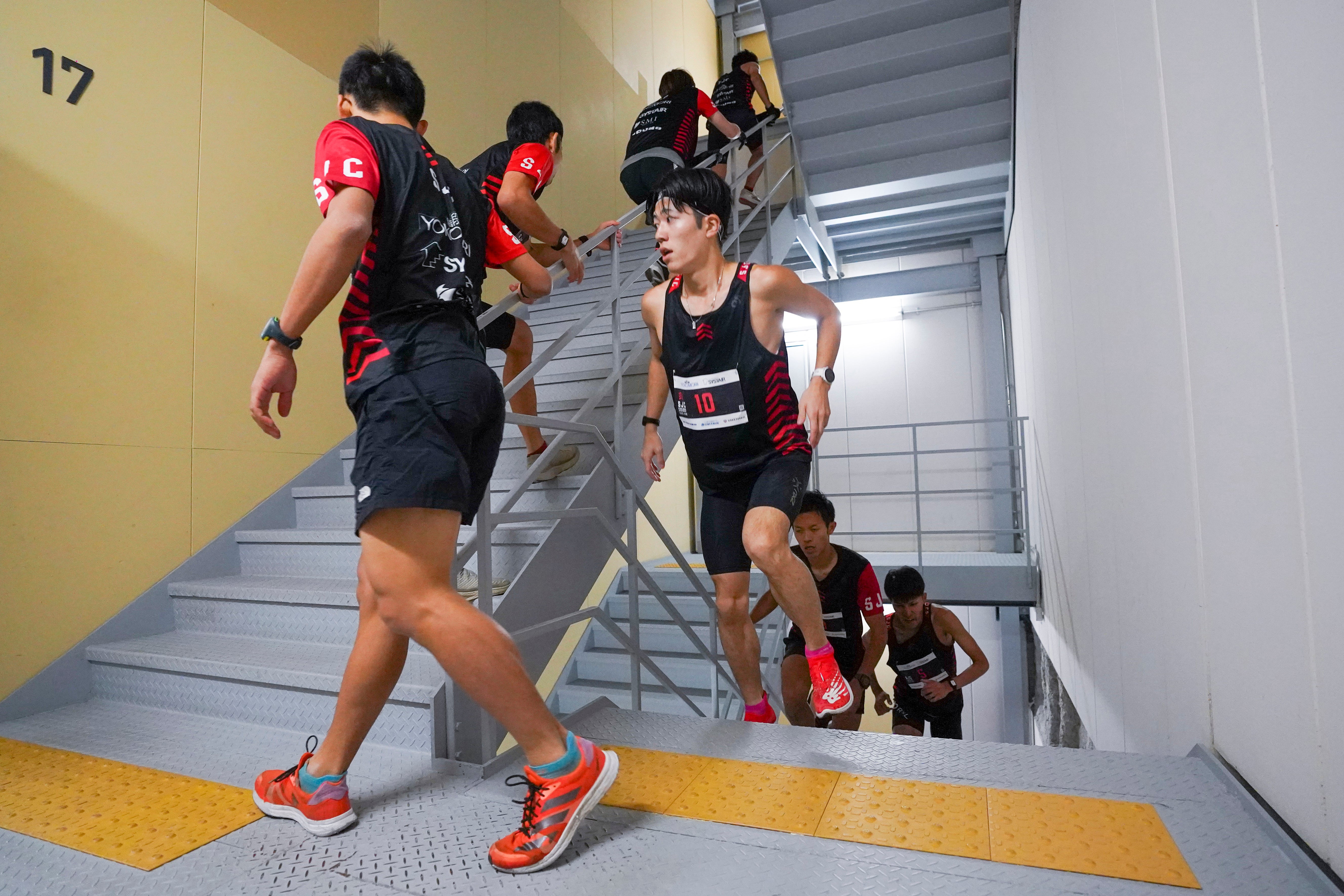 Competitors climb stairs during a race of Stairclimbing World Championships