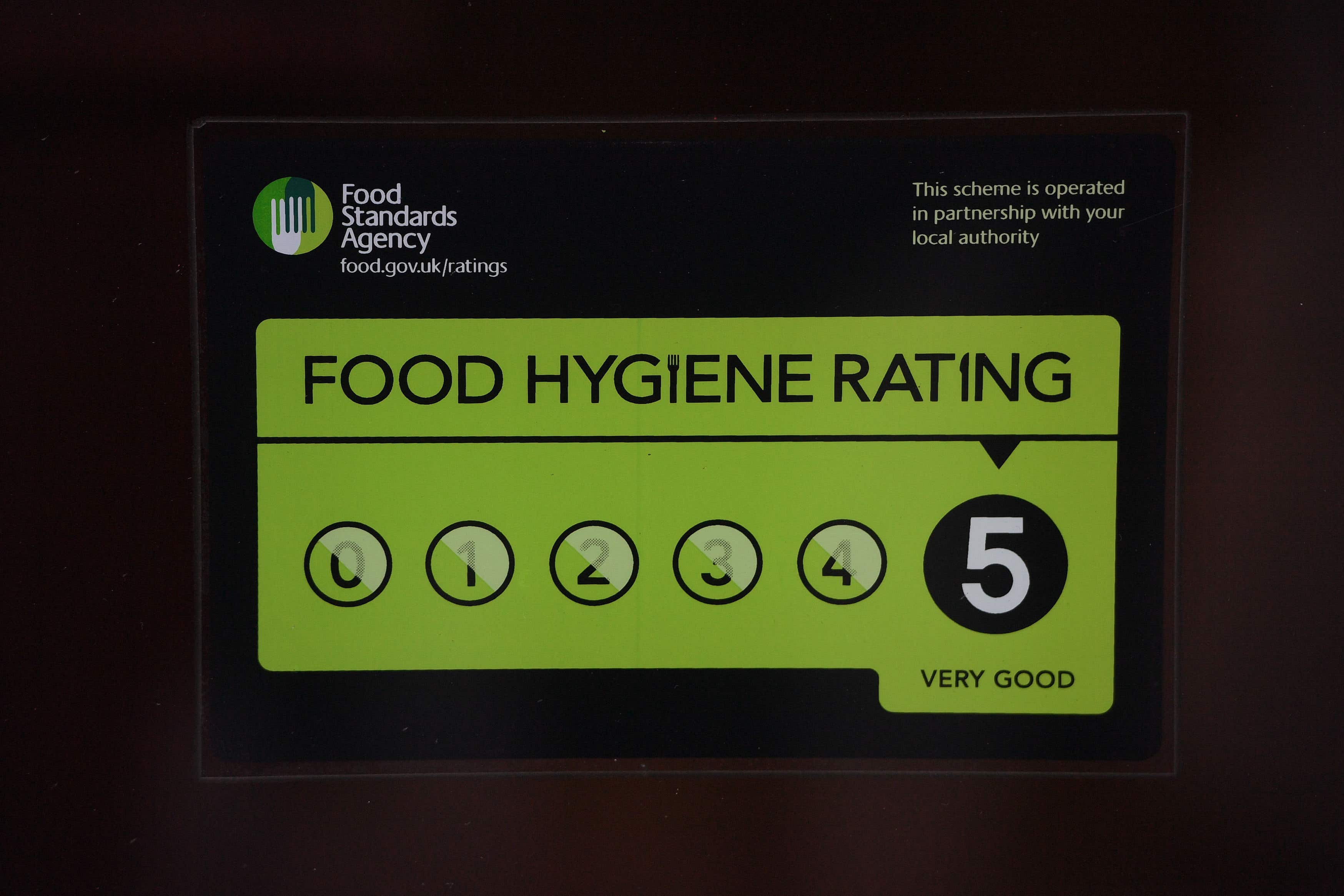 A Food Standards Agency rating sticker on a window of a restaurant in central London (PA)