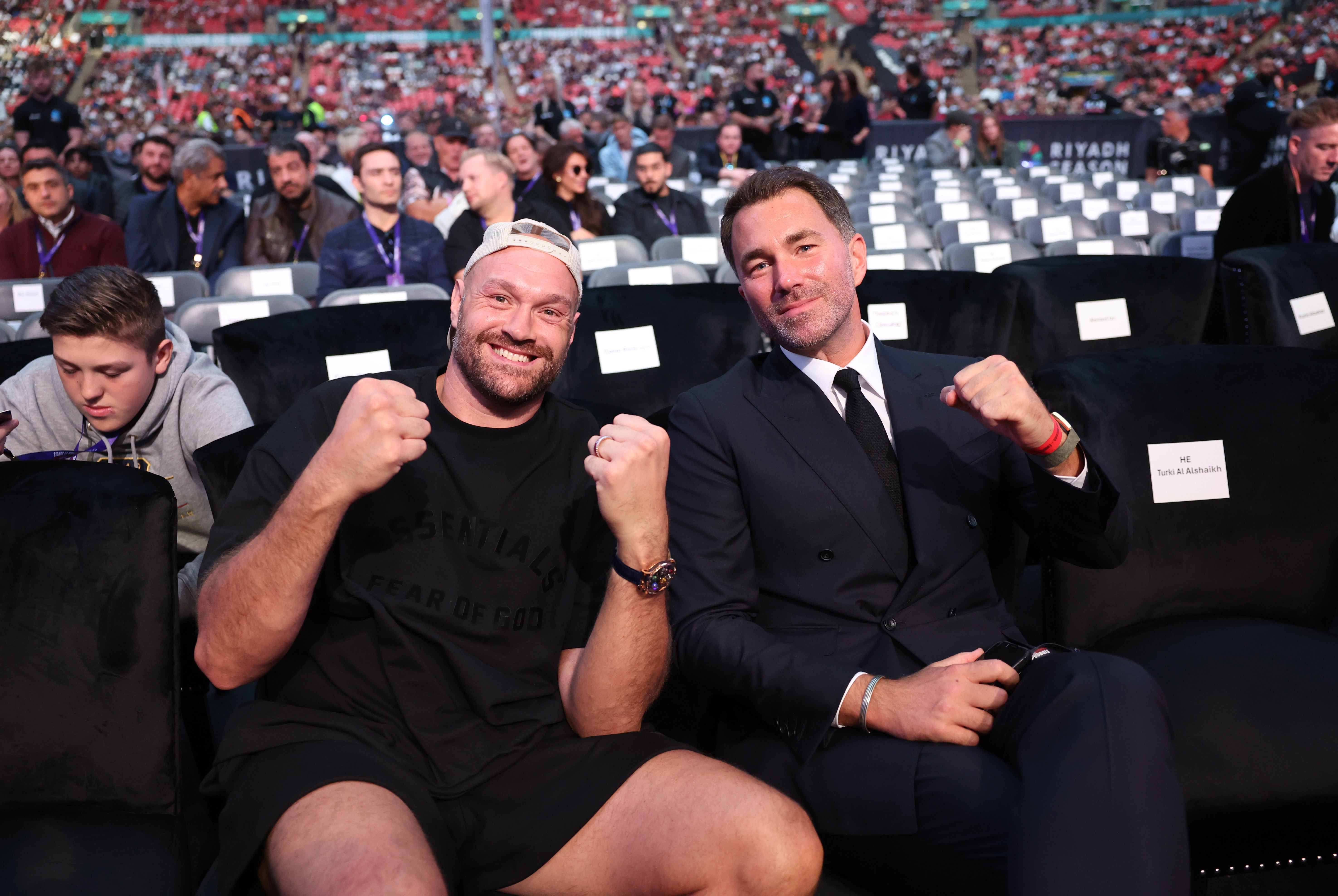 Tyson Fury and Eddie Hearn enjoy the undercard ringside