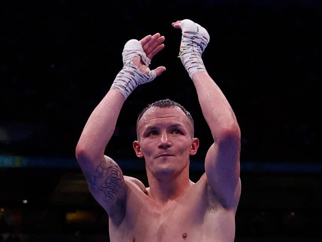 <p>Josh Warrington looks dejected after losing his fight against Anthony Cacace</p>