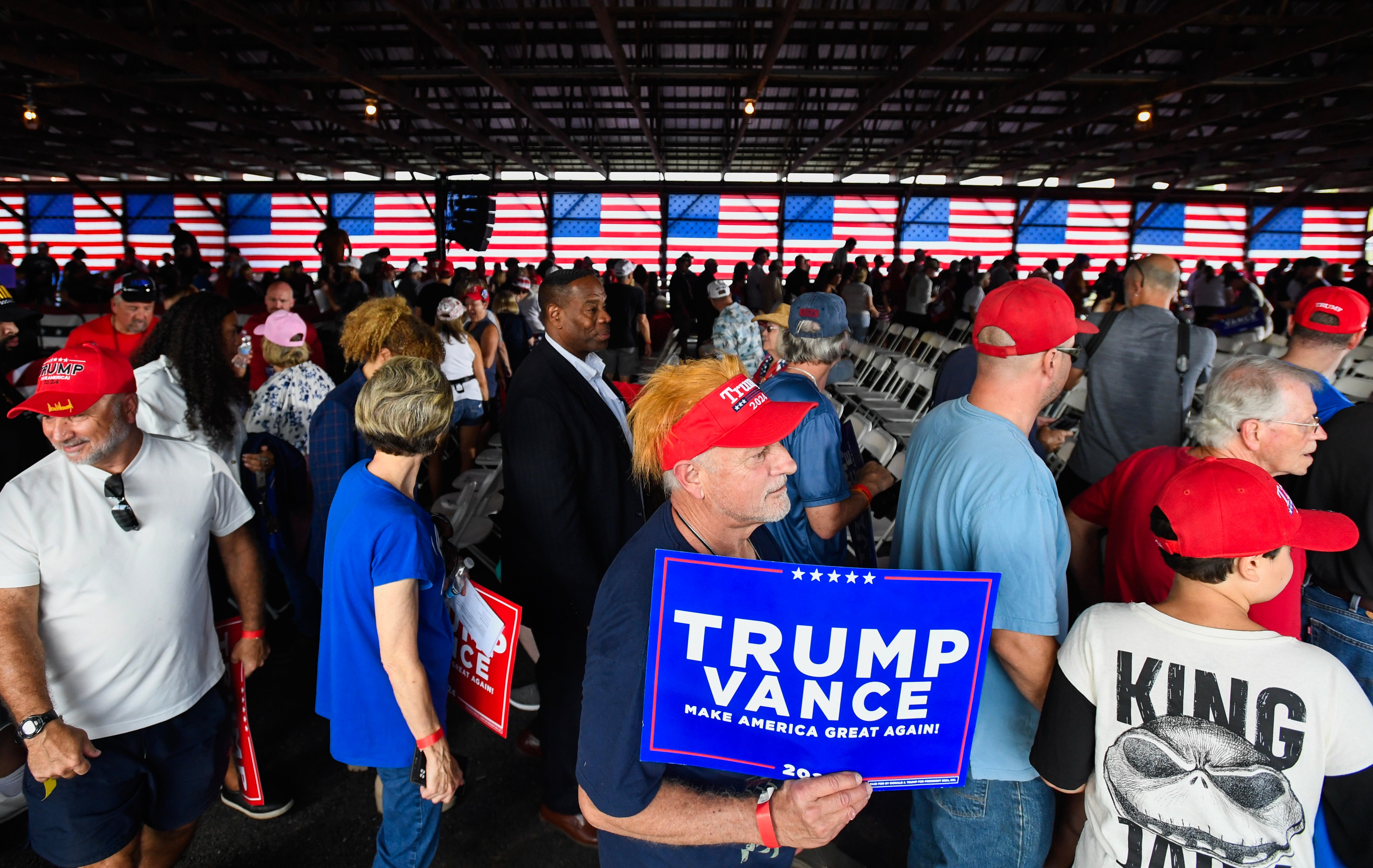 A man hold a “Trump Vance” sign at Vance’s campaign rally in Leesport, Pennsylvania