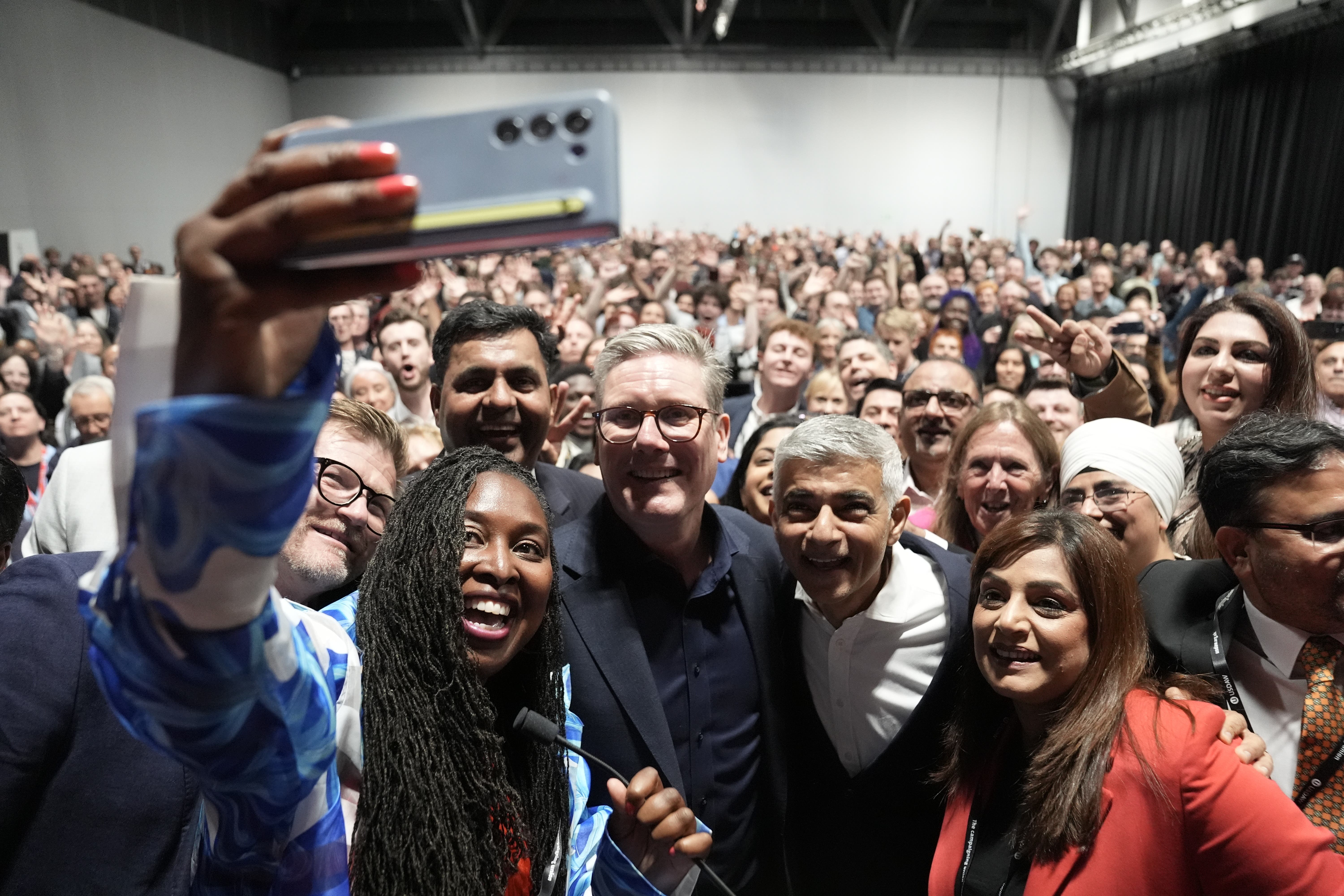 Prime Minister Sir Keir Starmer takes a selfie with Dawn Butler, MP for Brent East and Mayor of London Sadiq Khan at a reception during the Labour Party Conference in Liverpool. Picture date: Saturday September 21, 2024.