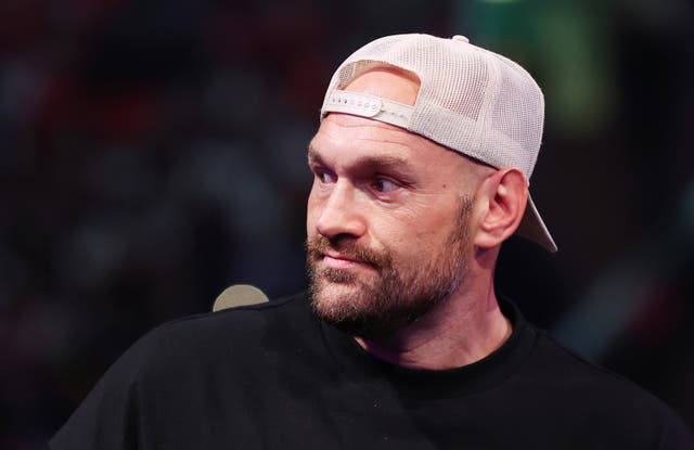 <p>Tyson Fury looks on ringside at Wembley Stadium</p>