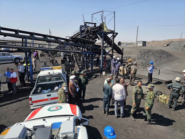 <p>Photo released by Iranian Red Crescent Society shows rescue personnel and police at the site of the coal mine blast in Tabas, on 22 September 2024</p>