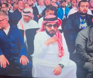 Turki Alalshikh appears to gesture at the camera during the fight