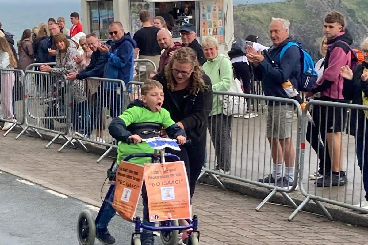 Boy, eight, with rare disease completes Ironkids Wales with walker ...