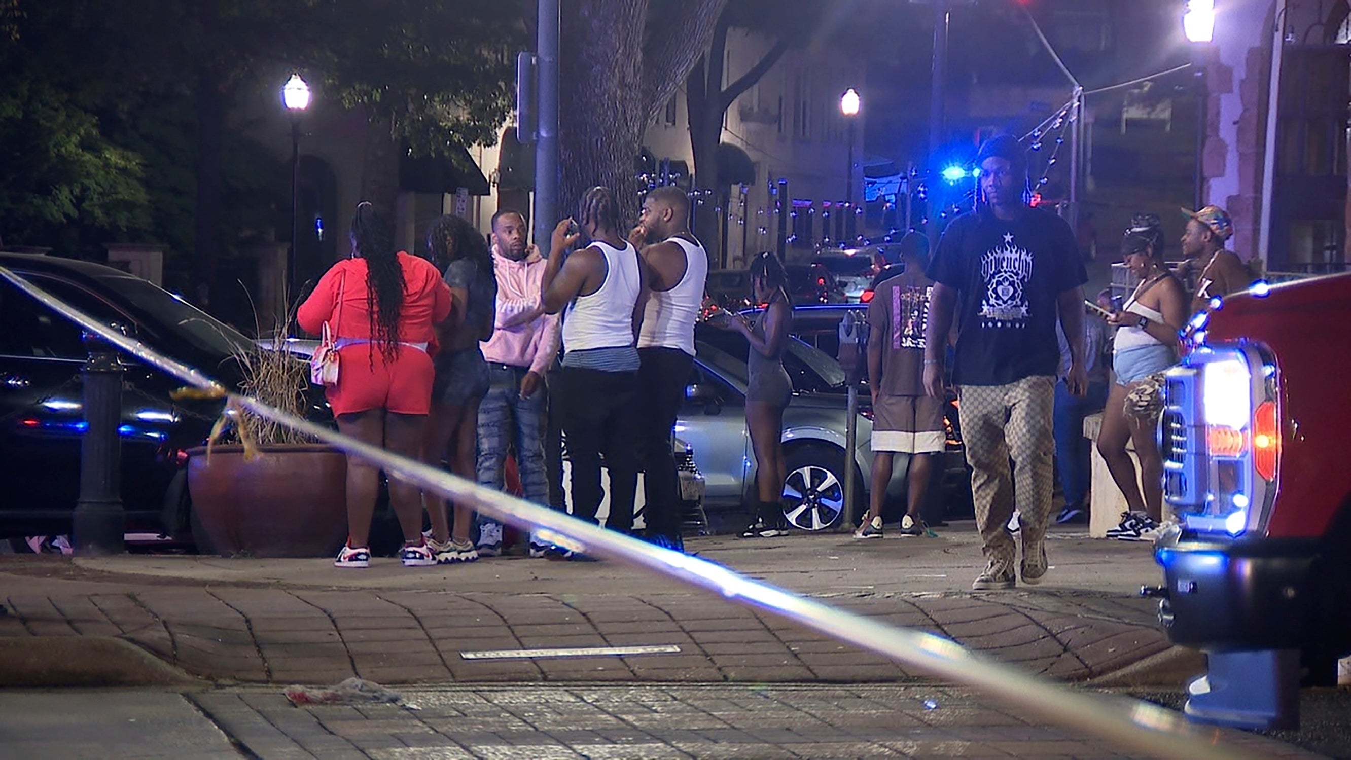 A group of people at the scene after over 100 shots were fired in Birmingham, Alabama on Saturday night