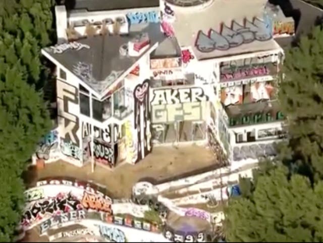 <p>An aerial view of an abandoned mansion at 7571 Mulholland Drive in Los Angeles, which has been taken over by taggers and squatters.</p>