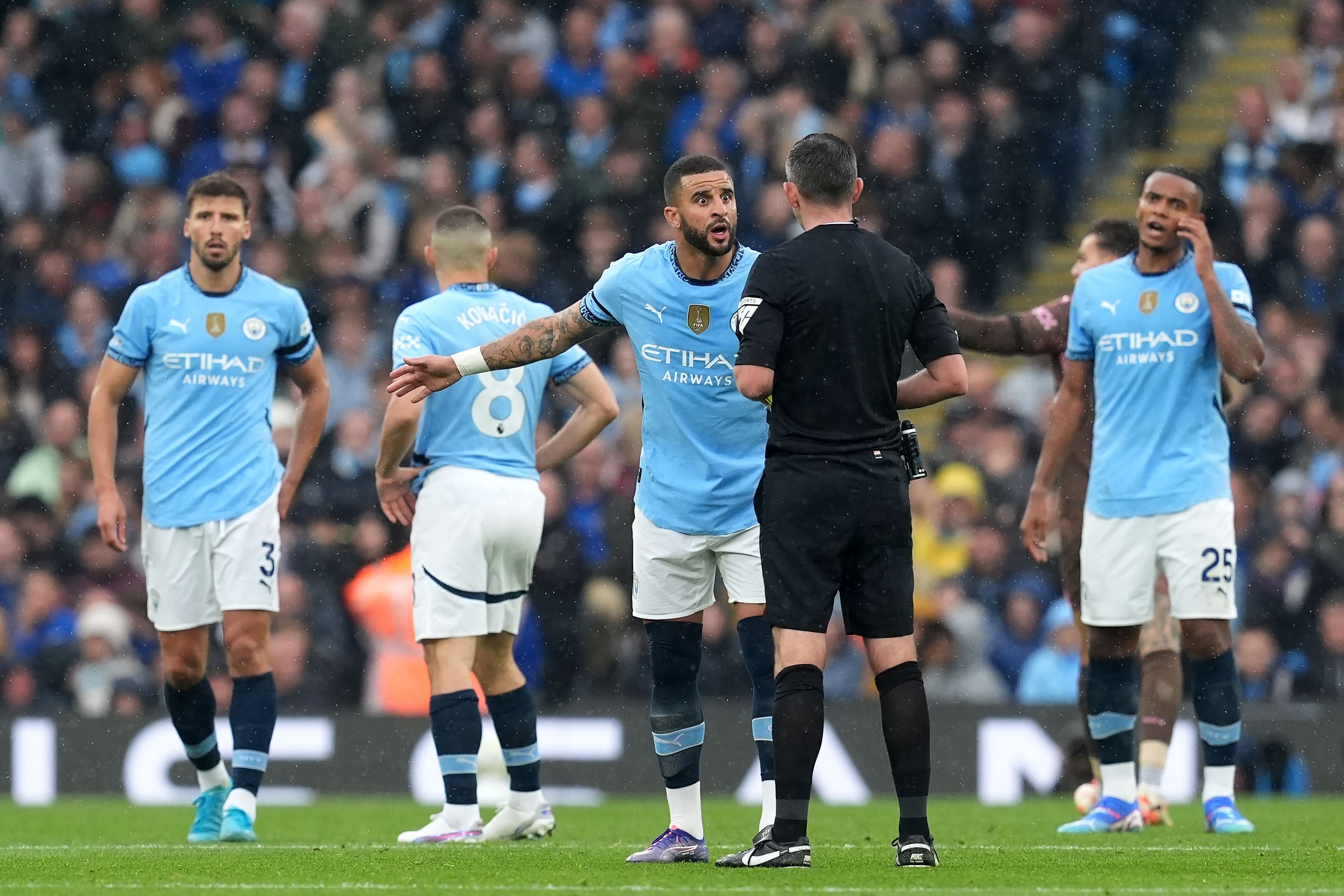 Kyle Walker was not happy with referee Michael Oliver (Martin Rickett/PA)