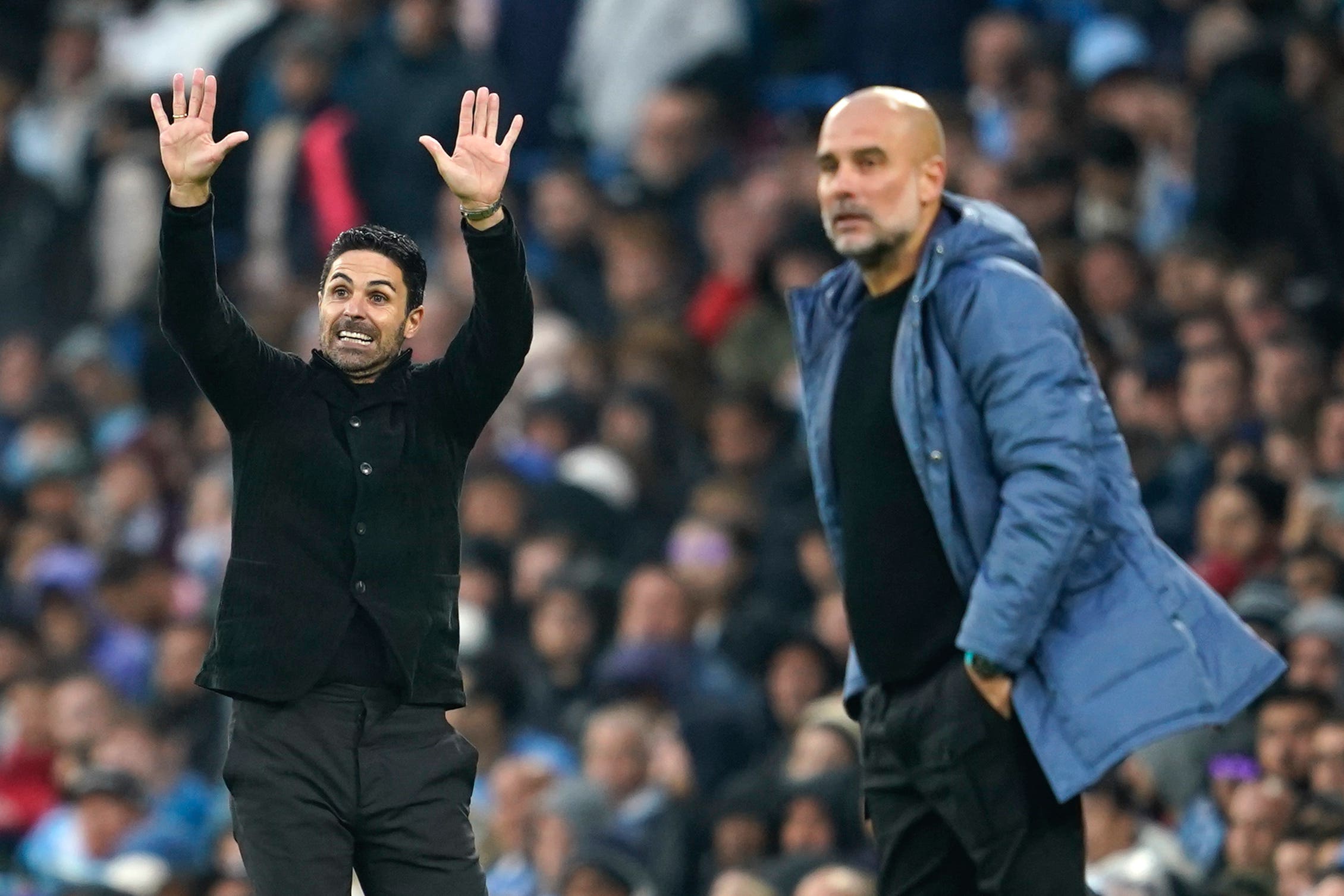 Arsenal’s manager Mikel Arteta, left, and Man City counterpart Pep Guardiola