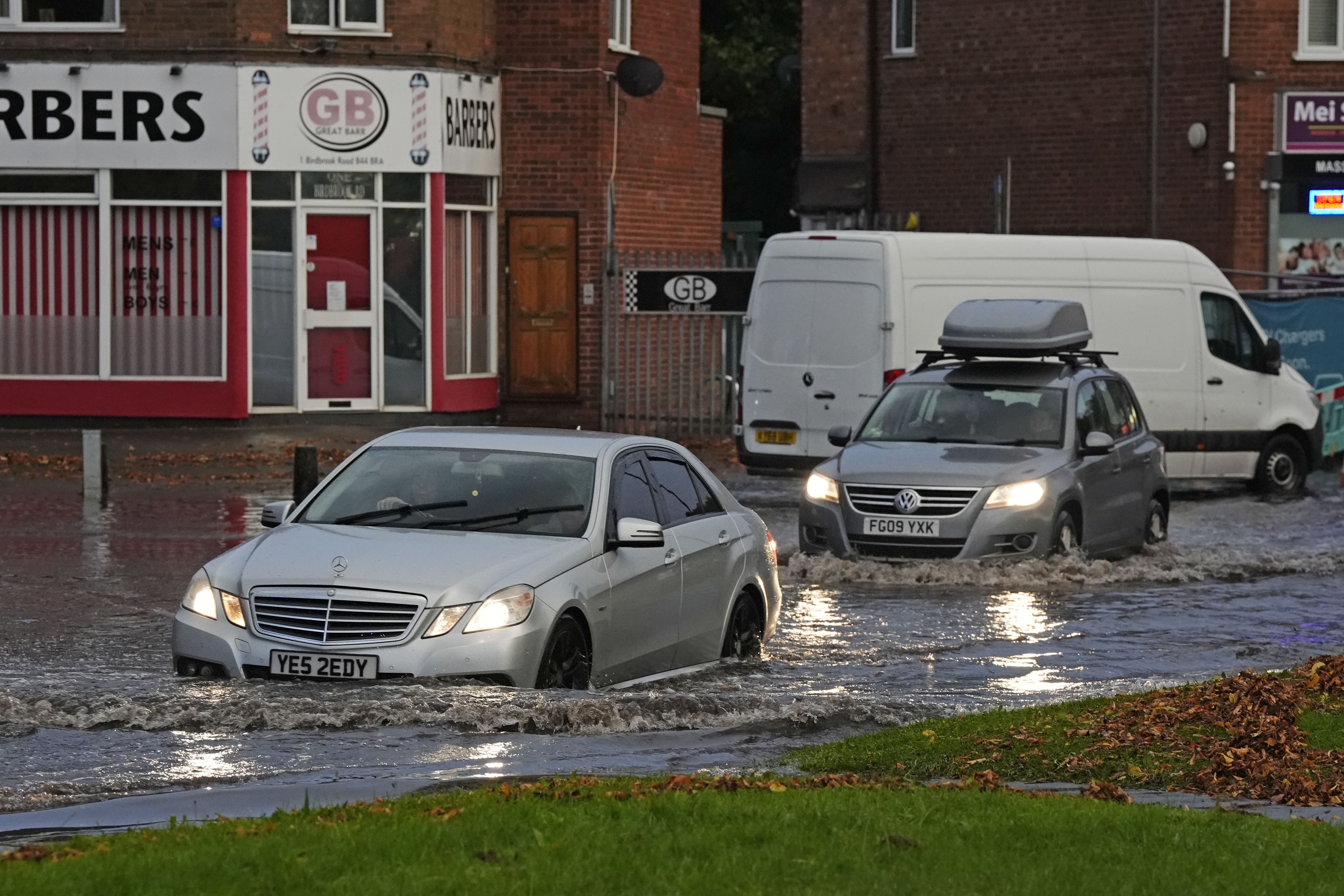 Vehicles drive through flood water in Perry Bar, Birmingham on September 21 (Nick potts/PA)