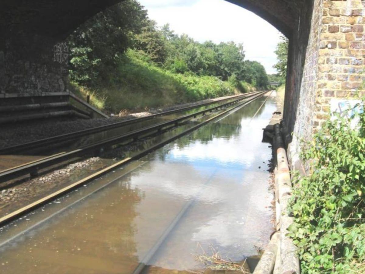 Travel chaos after overnight flooding in London and southeast England