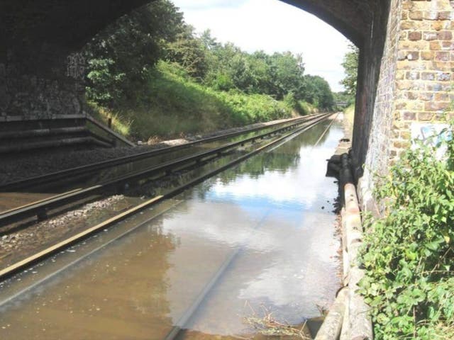 <p>Water line: Flooding on the railway at Fulwell in Oxfordshire (file photo)</p>