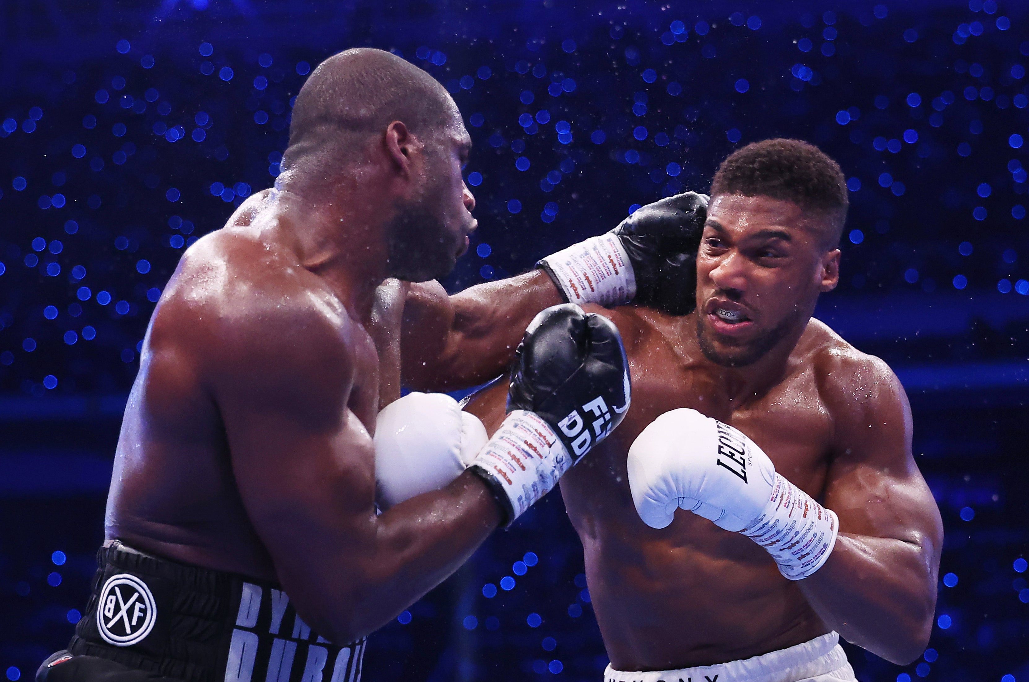 Daniel Dubois (left) and Anthony Joshua trade blows at Wembley Stadium