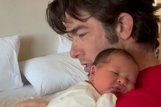 Olivia Munn films John Mulaney cuddling newborn daughter after welcoming second child via surrogate